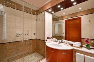 a bathroom with a sink and a shower at The Ritz-Carlton Jeddah in Jeddah