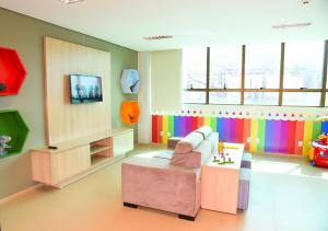 TV a/nebo společenská místnost v ubytování Hotel Plaza Garden