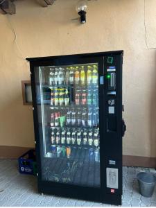 a vending machine filled with lots of bottles of soda at Ferienhaus Bayerlipp in Scheßlitz