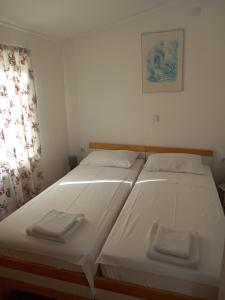 Säng eller sängar i ett rum på Villa Sonja apartments