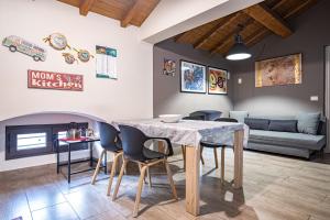 a kitchen and living room with a table and chairs at A Casa Mia - Catania Apartment in Catania