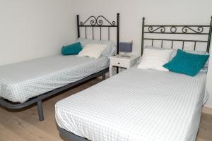 Postel nebo postele na pokoji v ubytování Los tres castells