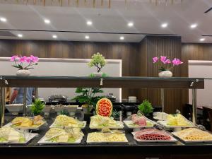 a buffet line with different types of food at Ramada by Wyndham Istanbul Umraniye in Istanbul