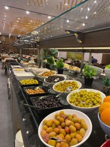 a buffet line with many plates of food at Ramada by Wyndham Istanbul Umraniye in Istanbul