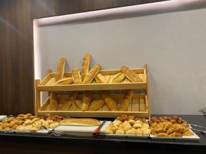 a display of bread and other types of food at Ramada by Wyndham Istanbul Umraniye in Istanbul