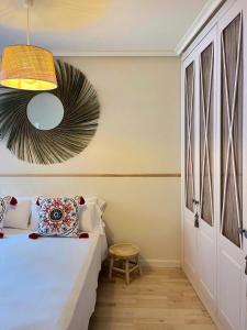 a bedroom with a bed and a pendant light at Jositown in Santander