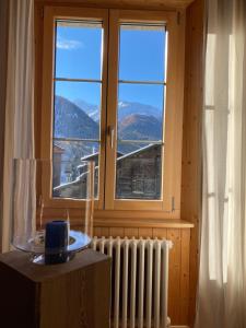 a window with a radiator and a view of a mountain at Römerhaus in Münster