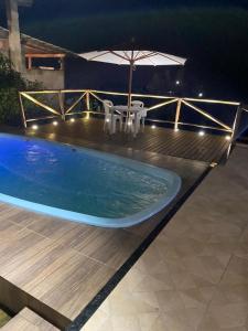 Πισίνα στο ή κοντά στο Casa Condominio nas Montanhas