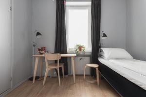 Postel nebo postele na pokoji v ubytování Heimen Hotel