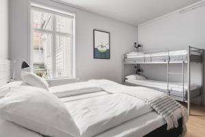 Postel nebo postele na pokoji v ubytování Heimen Hotel