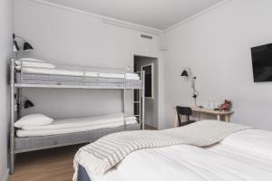 Postel nebo postele na pokoji v ubytování Heimen Hotel