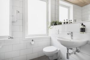 Koupelna v ubytování Heimen Hotel
