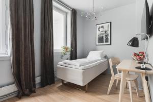 Postel nebo postele na pokoji v ubytování Heimen Hotel