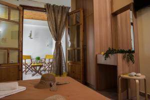 a room with a table with a hat on top of it at Summer Bed Nydri in Nydri
