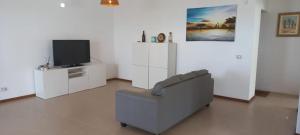 TV a/nebo společenská místnost v ubytování Kasa n'areia, Praia Estoril