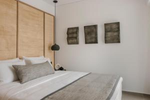 Cama ou camas em um quarto em Grace Mykonos