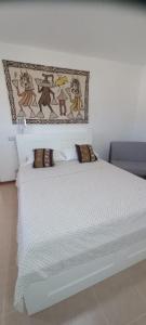 Postel nebo postele na pokoji v ubytování Kasa n'areia, Praia Estoril
