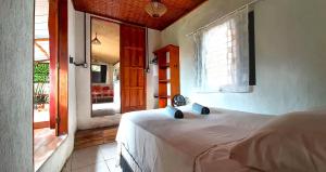 Postel nebo postele na pokoji v ubytování Casa Cacau Boipeba