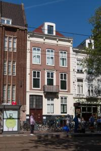 a group of buildings with people standing in front of them at B&B Midtown Amsterdam suites in Amsterdam