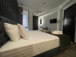 Postel nebo postele na pokoji v ubytování Bellevue Boutique Hotel