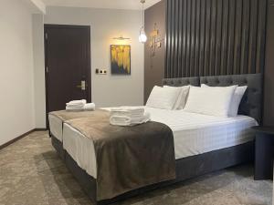 Postel nebo postele na pokoji v ubytování Bellevue Boutique Hotel