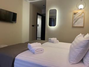 Postel nebo postele na pokoji v ubytování Bellevue Boutique Hotel