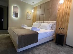 Postel nebo postele na pokoji v ubytování Bellevue Boutique Hotel