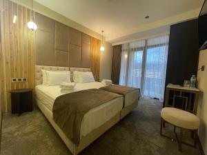 Postel nebo postele na pokoji v ubytování Bellevue Boutique Hotel
