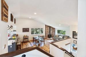 a kitchen and living room with white walls and a table at Yosemite Oasis in Mariposa