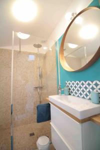a bathroom with a sink and a mirror at La Pidellerie bord de Cher-Châteaux de la Loire in Véretz +35 photos