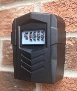 a black electrical outlet on a brick wall at The Gainsborough Mews-stylish & modern (sleeps 3) in Lincolnshire