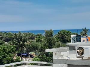 a view of the ocean from a building at Le Poshe Beachview in Pondicherry