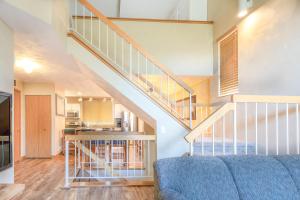 a living room with a staircase in a house at Seven Springs 2BRLoft Premium Condo, sleeps 11! condo in Champion