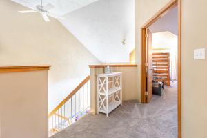a staircase in a house with a ceiling fan at Seven Springs 2BRLoft Premium Condo, sleeps 11! condo in Champion