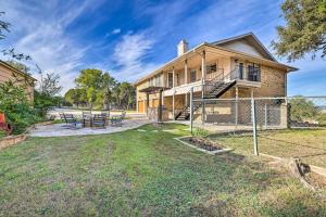 a house with a fence and a yard at Canyon Lake Home Hill Country and Water Views! in Canyon Lake