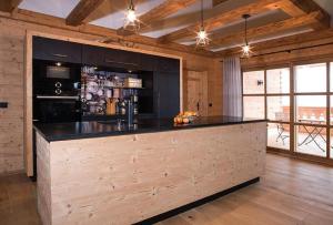 a kitchen with a large island in a room at Chalet Schönbuchet in Mauth