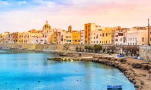 a view of a river in a city with buildings at DGS APARTHOTEL in Trapani