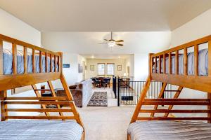 a room with two bunk beds and a living room at Serenity Bungalow in Dover