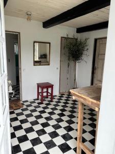 a room with a black and white checkered floor at The Beach Farm - charm, beach and stunning nature in Bedsted Thy
