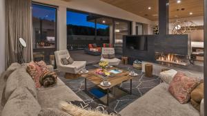 a living room with a couch and a fireplace at Butterfly Lofts - West in Steamboat Springs