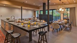 a kitchen and dining room with a large table and chairs at Butterfly Lofts - West in Steamboat Springs