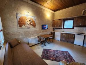 a living room with a couch and a table at Key of Cappadocia - House of Eos in Avanos