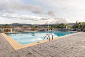 a swimming pool at a resort with at serendipity on the beach Ocho Rios in Saint Annʼs Bay