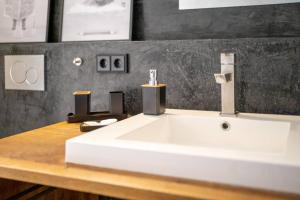 a bathroom with a white sink on a counter at Über den Dächern der Innenstadt Ravensburgs in Ravensburg