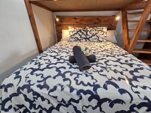 a bedroom with a bed with a blue and white comforter at JUMA HOLIDAYS in Puerto del Carmen +16 photos
