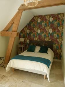 Katil atau katil-katil dalam bilik di Gite le long bois campagne charme 6 pers