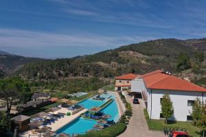 an aerial view of a resort with a swimming pool at Douro Cister Hotel Resort in Ucanha