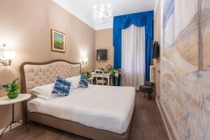 Letto o letti in una camera di Hotel Ristorante Ala d'Oro