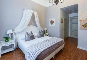Letto o letti in una camera di Hotel Ristorante Ala d'Oro