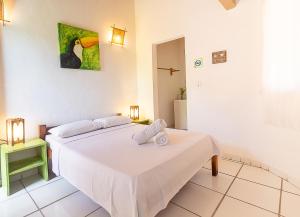 Postel nebo postele na pokoji v ubytování Na Casa 11 - Pousada e Hostel